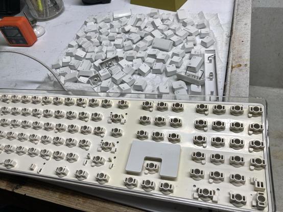 A disassembled Apple keyboard.