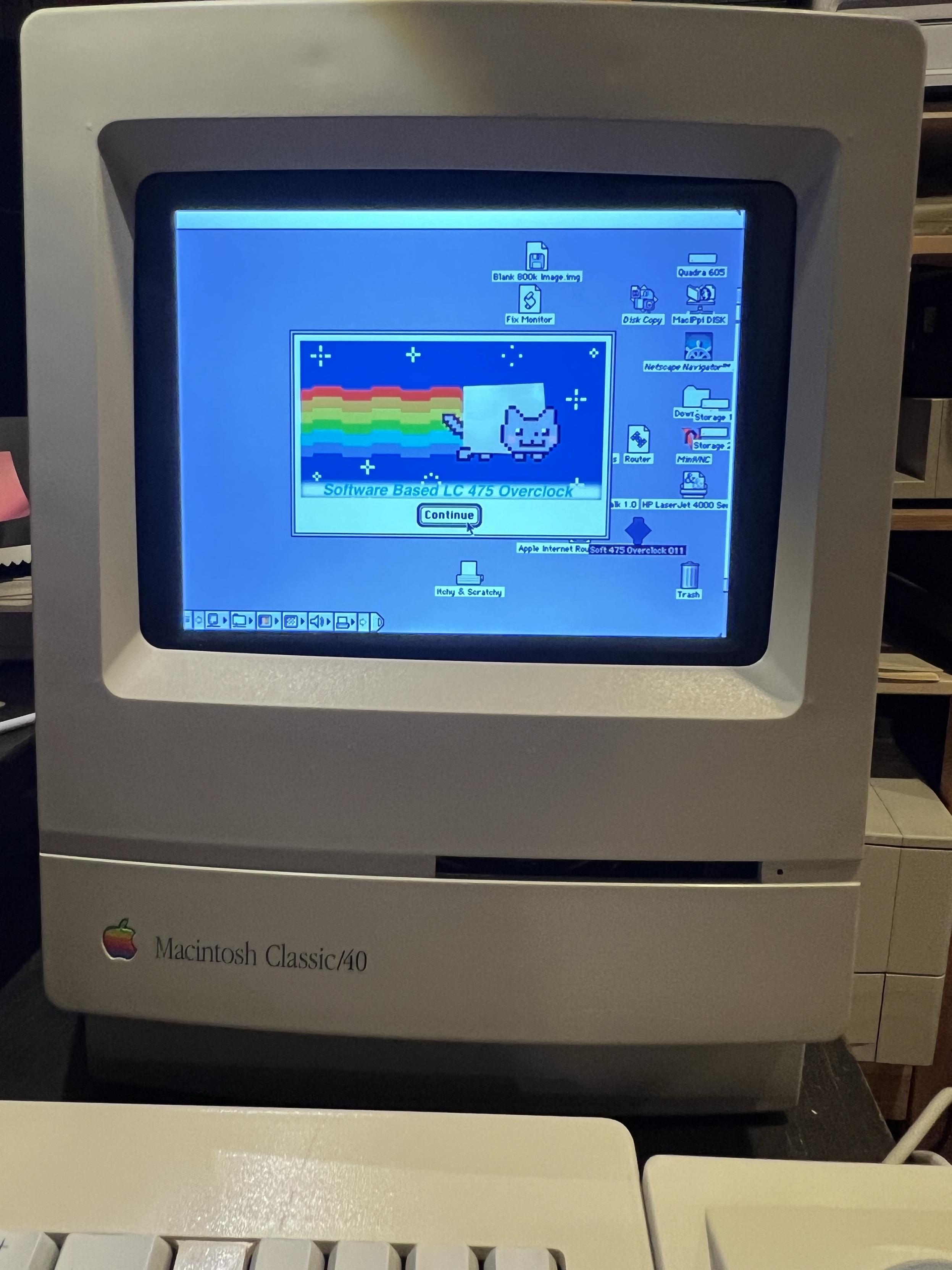 A Mac Classic case with a color LCD inside showing Nyan Cat.