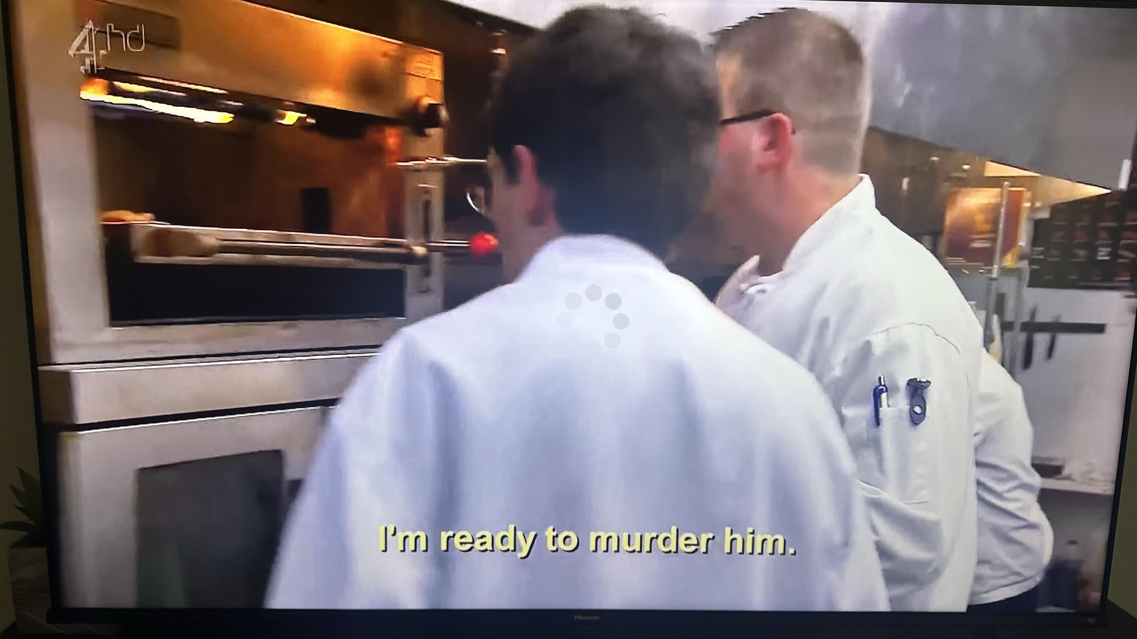 The backs of two chefs looking at an oven. The subtitle reads "I'm ready to murder him"