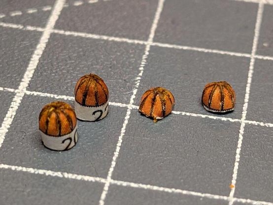 The turn signals halfway through their production. The left two still have the paper tube attached, the right two are in their final state.