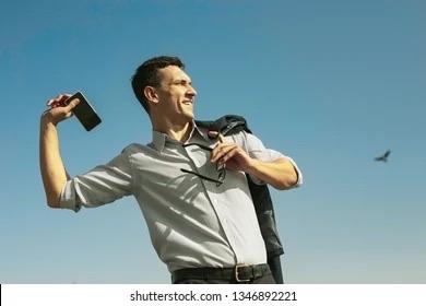 Stock photo of man about to throw his phone 