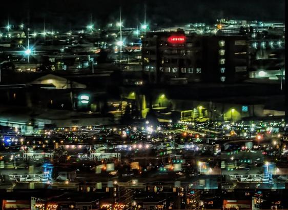 Manipulated multiple exposure of bright lights in industrial Portland Oregon shot from the Fremont Bridge at night.