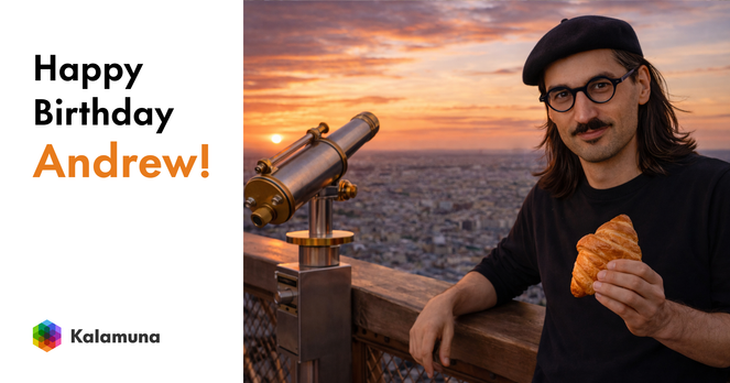 Andrew stands on an observation deck at sunset, overlooking a sprawling city skyline. He wears a black beret and round glasses and holds a croissant in one hand. A coin-operated telescope sits beside him, pointed toward the horizon. On the left side of the image, large text reads “Happy Birthday Andrew!” with the Kalamuna logo below.