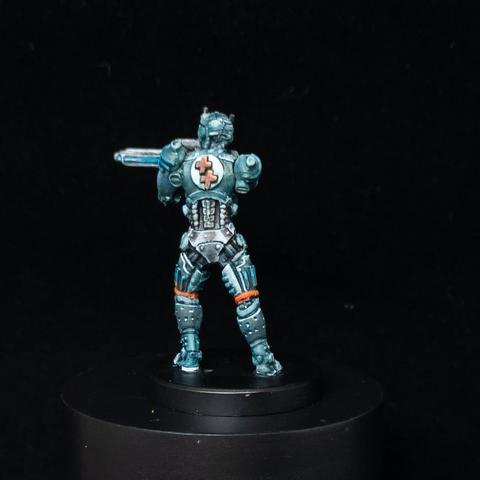 Solider in blue, green and white armour with orange OSL. Rear shot.