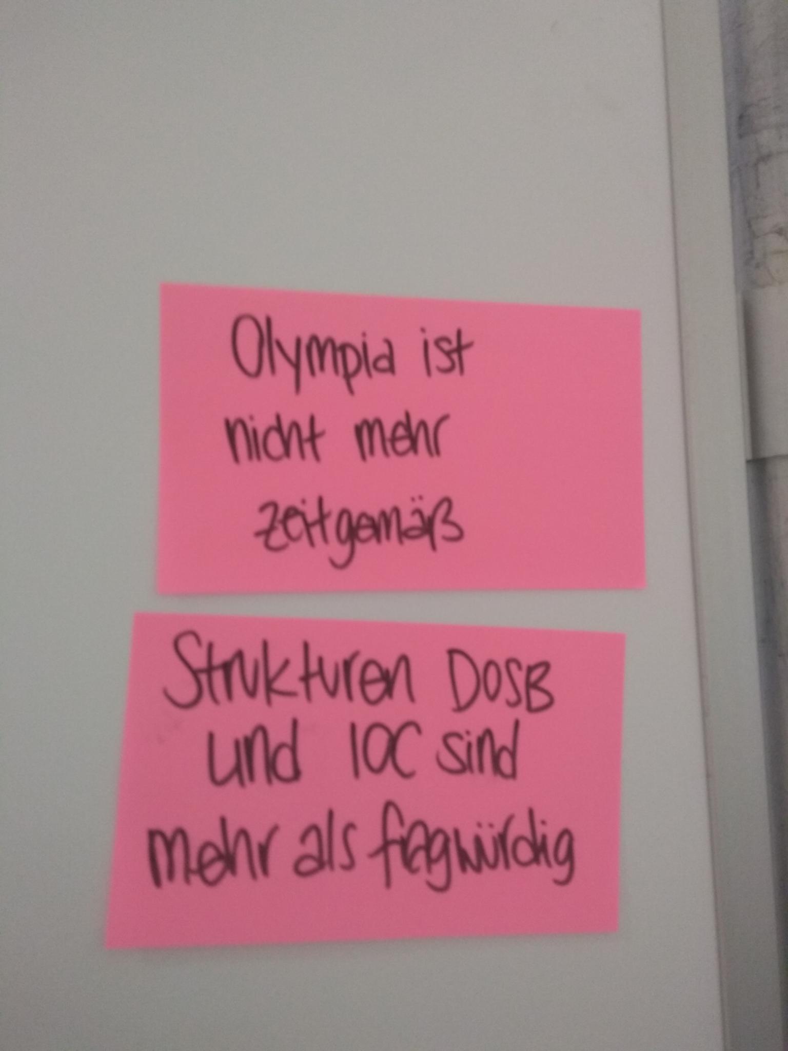 Klebezettel mit Zweifeln an Olympia