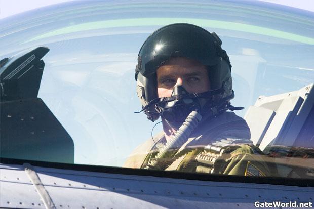 Colonel Mitchell sitting in the cockpit of an Airforce fighter jet.