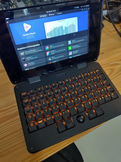 pocket reform up and running again, with orange keyboard backlight, and bazaar store on the display. i'm currently using 150% scale on the internal display.