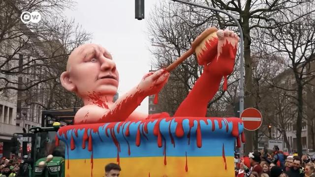 A Putin sculpture taking a bath in blood.