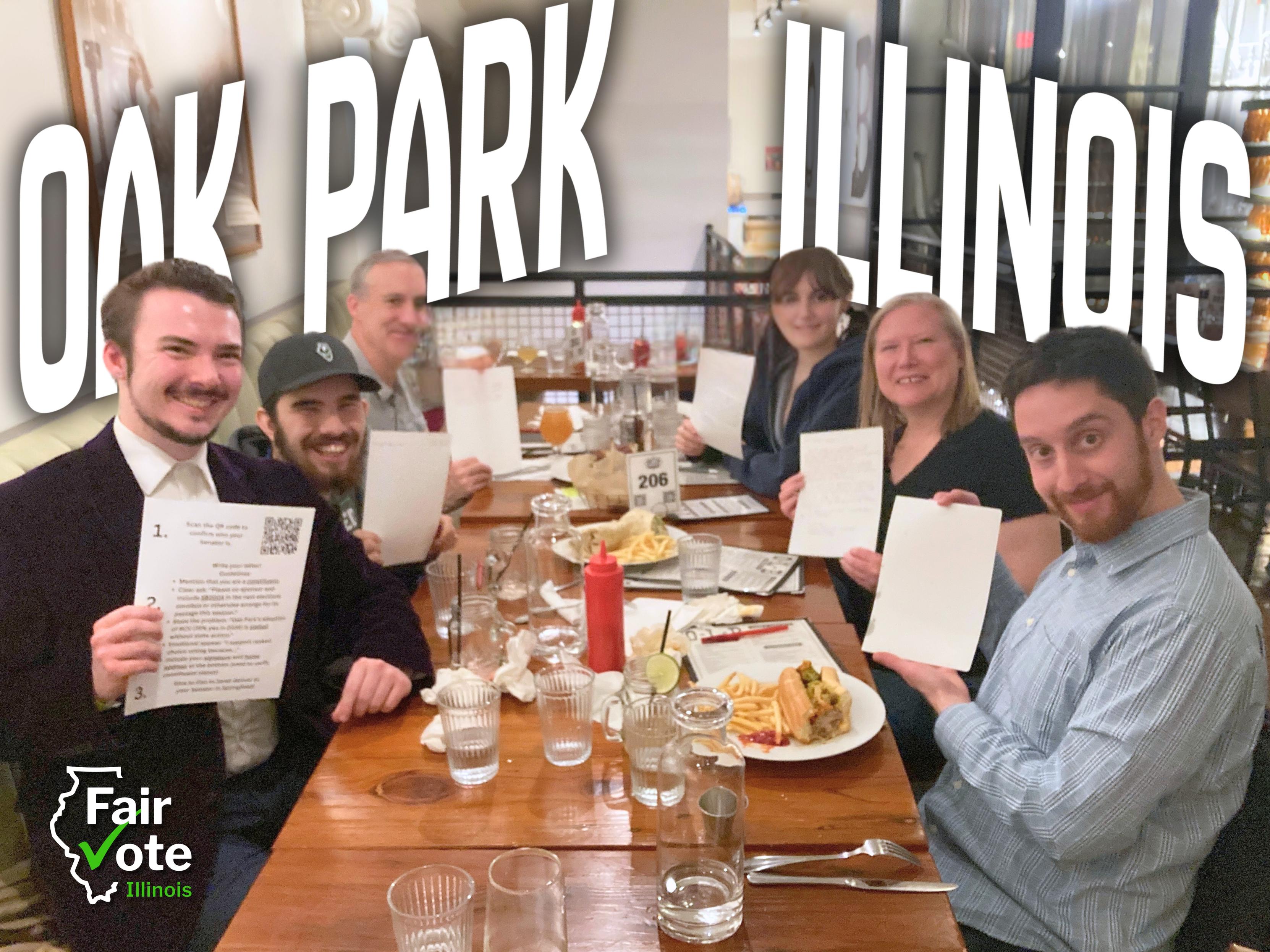 Six people seated around a dinner table holding up letters addressed to their Illinois state senators.