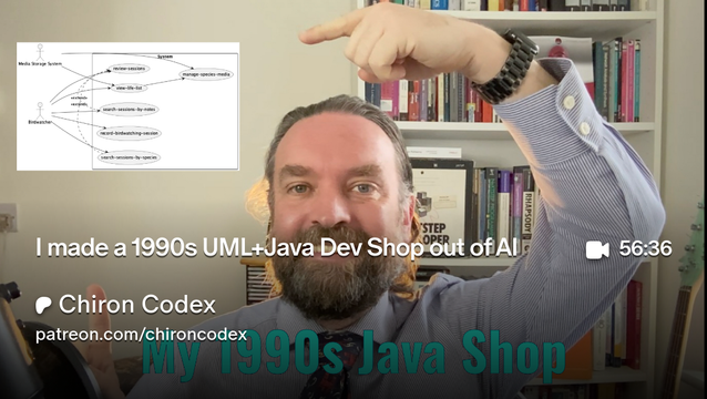 A picture of the author pointing at a UML diagram that's part of a system his AI agent collection generated.