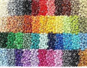 A grid of various piles of Lego one by one studs in 43 different colors forming a rainbow mosaic plastic