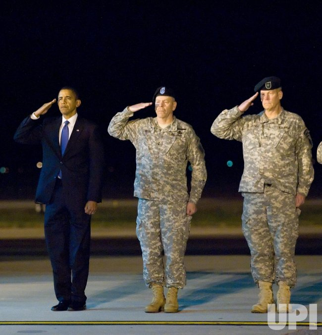 President Barack Obama, Army Maj. Gen. Daniel V. Wright, and Army Brig. Gen. Michael S. Repass render honors during as a team of Soldiers carry the remains of Sgt. Dale R. Griffin during a dignified transfer ceremony at Dover Air Force Base, Delaware on October 29, 2009. Griffin, who was assigned to 1st Battalion, 17th Infantry Regiment, 5th Stryker Brigade Combat Team, 2nd Infantry Division, was killed in action on October 27, 2009, by a roadside bomb in the Kandahar province of Afghanistan. UPI/Jason Minto/U.S. Air Force