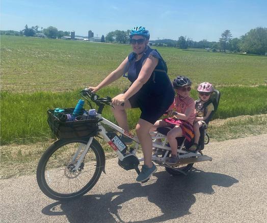 Kelda Roys on an ebike with her kids.