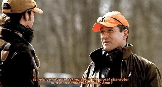 Tom in hunting gear talking to Greg. "Is he nice? You're asking me about the moral character of a man named Rat fucker Sam?"