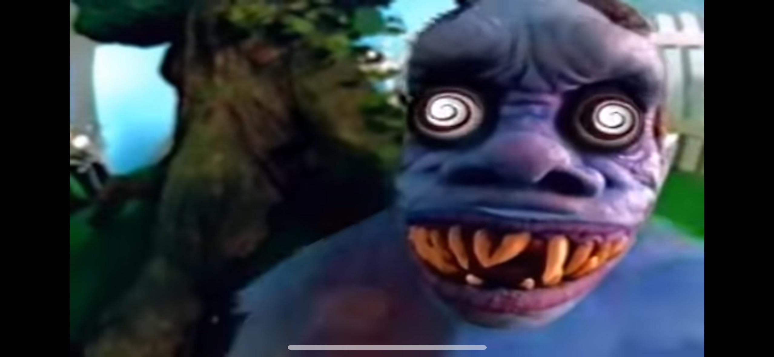 A monster with big snarling teeth and spinning eyes.