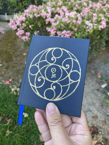 Small book with golf foil design on the cover