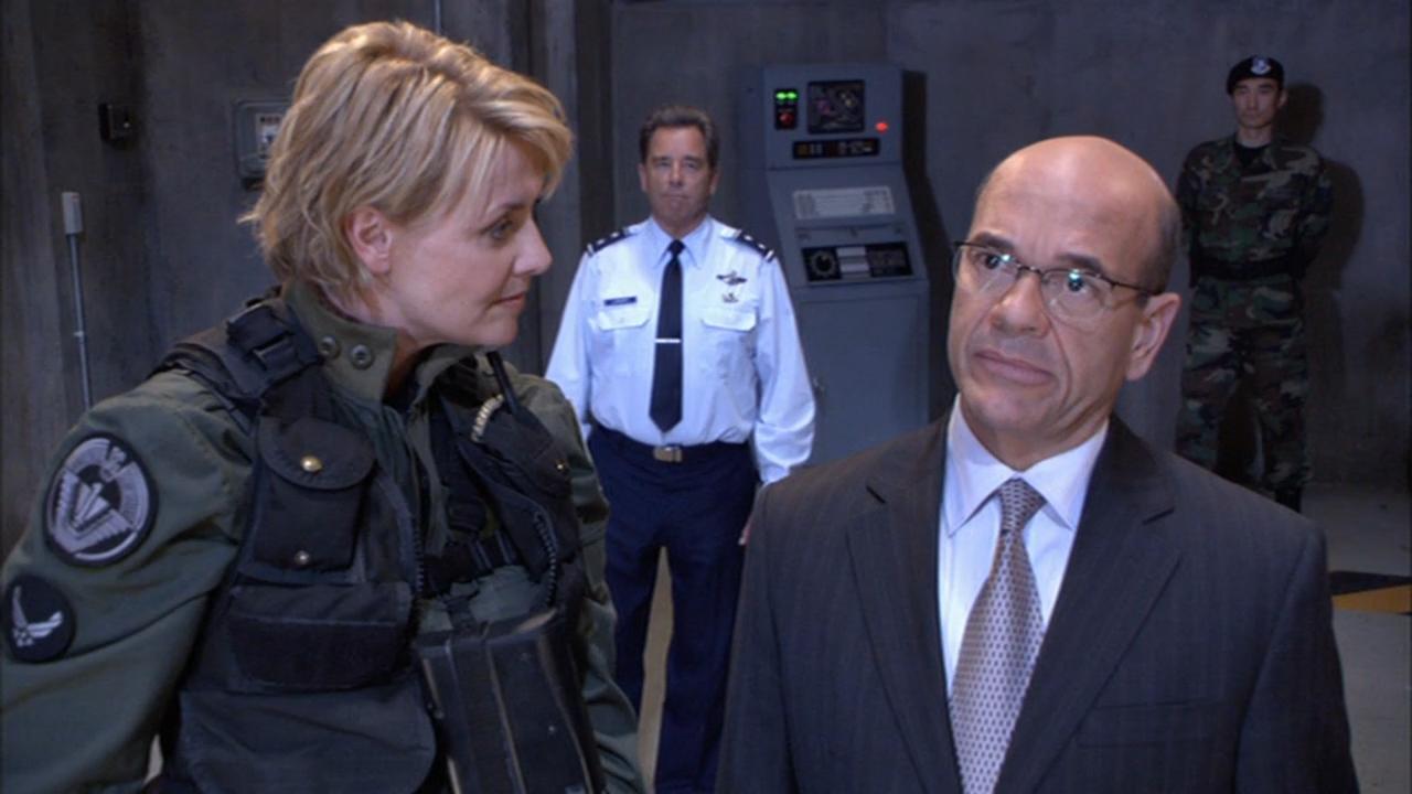 Colonel Carter escorts Mr. Wolsey through the Stargate