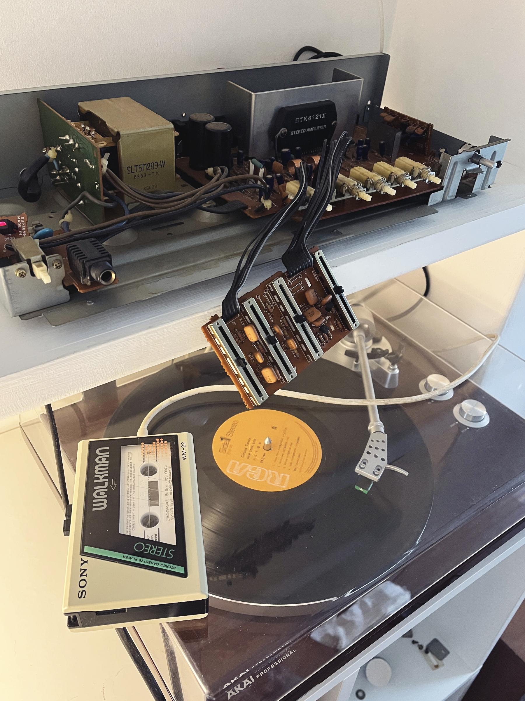 First test of the amp with inputs from turntable, Walkman and AirPlay. The unit is powered on and connected to devices but still without its cover or fascia.