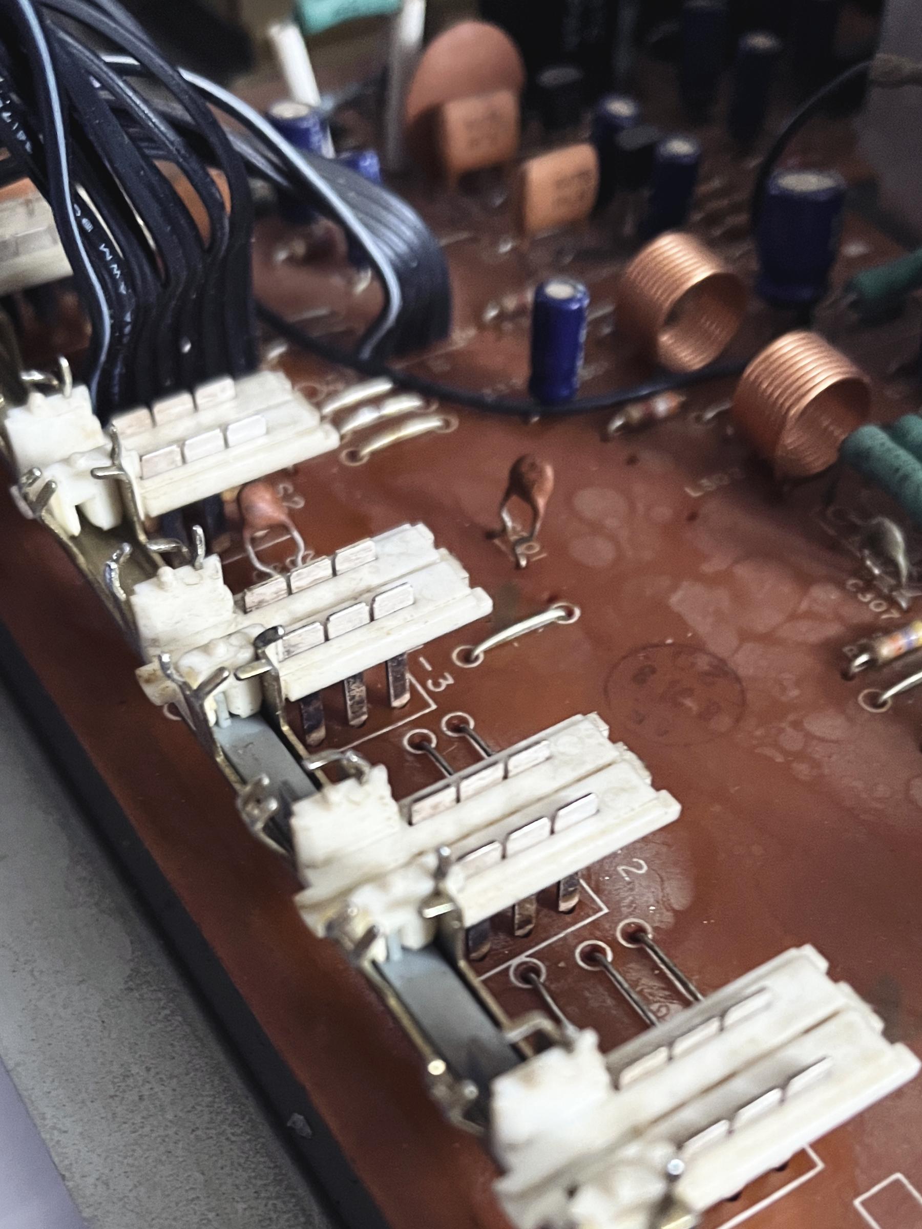 Input switches taken apart showing that the tiny metal switch plates have been cleaned thoroughly.