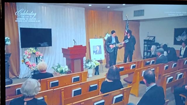 Tim Heidecker and Axiom sing "The Time Of Your Life" at the end of a memorial ceremony for G. Amato.