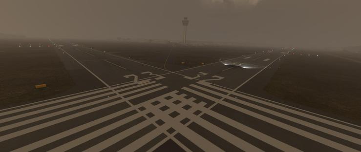 An aircraft is positioned on a runway marked with the numbers 23 and 32, its landing lights illuminating the wet pavement near the intersection of two taxiways. The scene is enveloped in thick fog, which diffuses light and reduces visibility, making distant objects like the air traffic control tower appear faint and ethereal. The runway surface features bold white directional markings, including dashed lines, solid stripes, and numerical identifiers, while extended runways stretch into the haze, lined with blue and red lights. Surrounding the paved areas are dark, grassy fields, and the fog creates a uniform gray backdrop that blurs the horizon. The aircraft’s presence suggests preparation for takeoff or landing under low-visibility conditions, with the control tower standing prominently in the background despite the reduced clarity. The overall atmosphere is quiet and muted, emphasizing the industrial scale of the airport amid the foggy conditions.