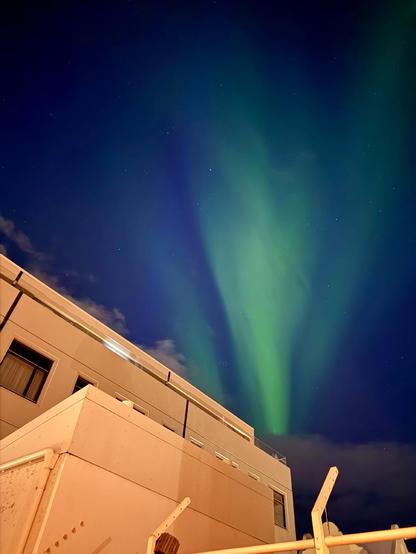 Aurora from the parking lot behind my hotel in downtown Reykjavík 