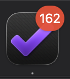 The OmniFocus dock icon with a red counter badge reading "162".