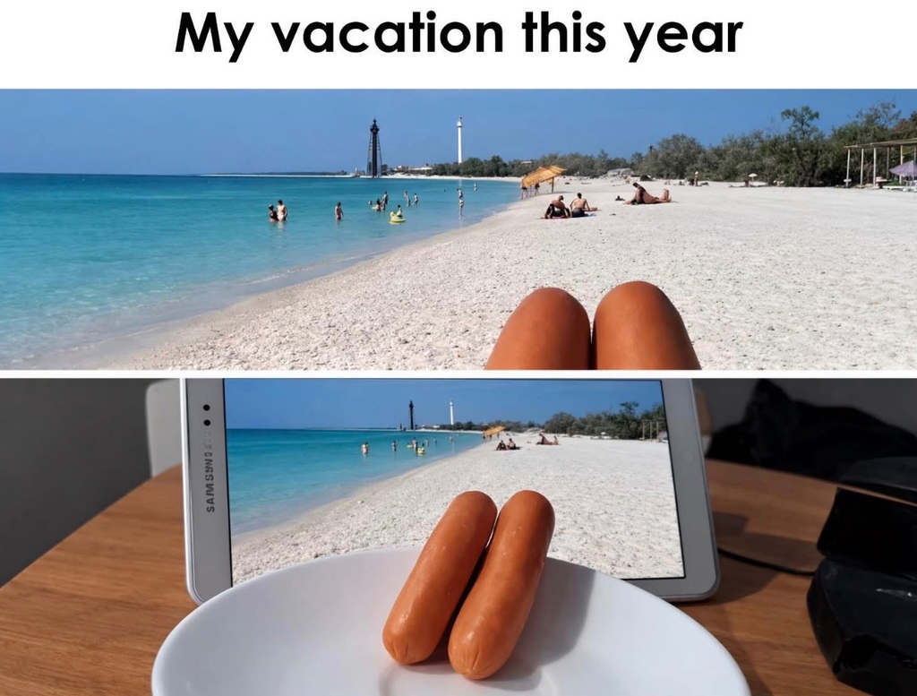A split image. The top half shows what looks like a first-person view of legs on a sunny beach, captioned "My vacation this year." The bottom half reveals the reality: two hot dog sausages are placed on a white plate in front of a tablet screen displaying a beach wallpaper.