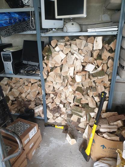 Full wood storage shelves in the garage. Seemingly also the location of a Mac graveyard. There's a Sparc Ultra 5 buried in here somewhere - holy ground, no doubt.