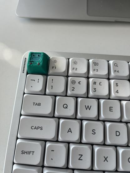 A mechanical keyboard with a raised key that’s BMO from Adventure Time, where the Escape key would normally be