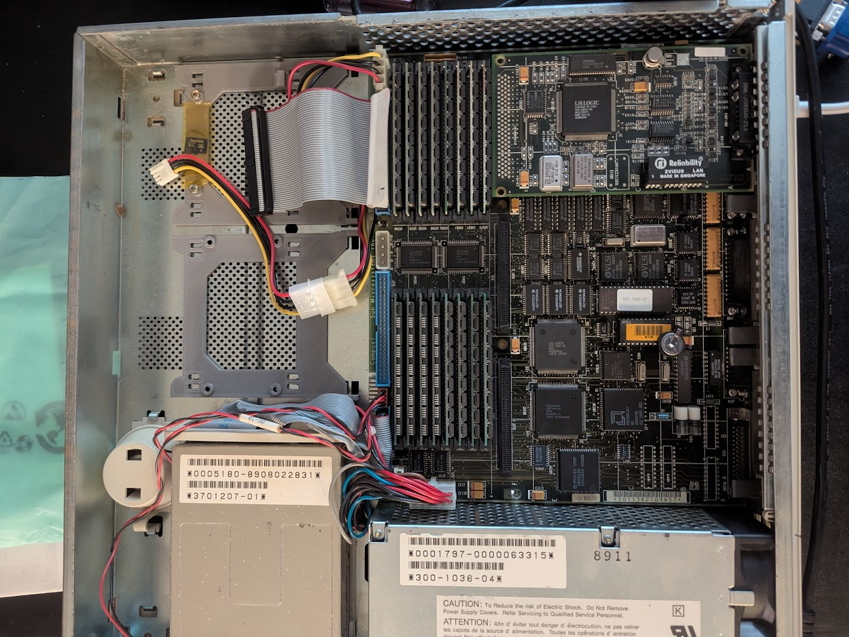 pizza box computer with the lid lifted.