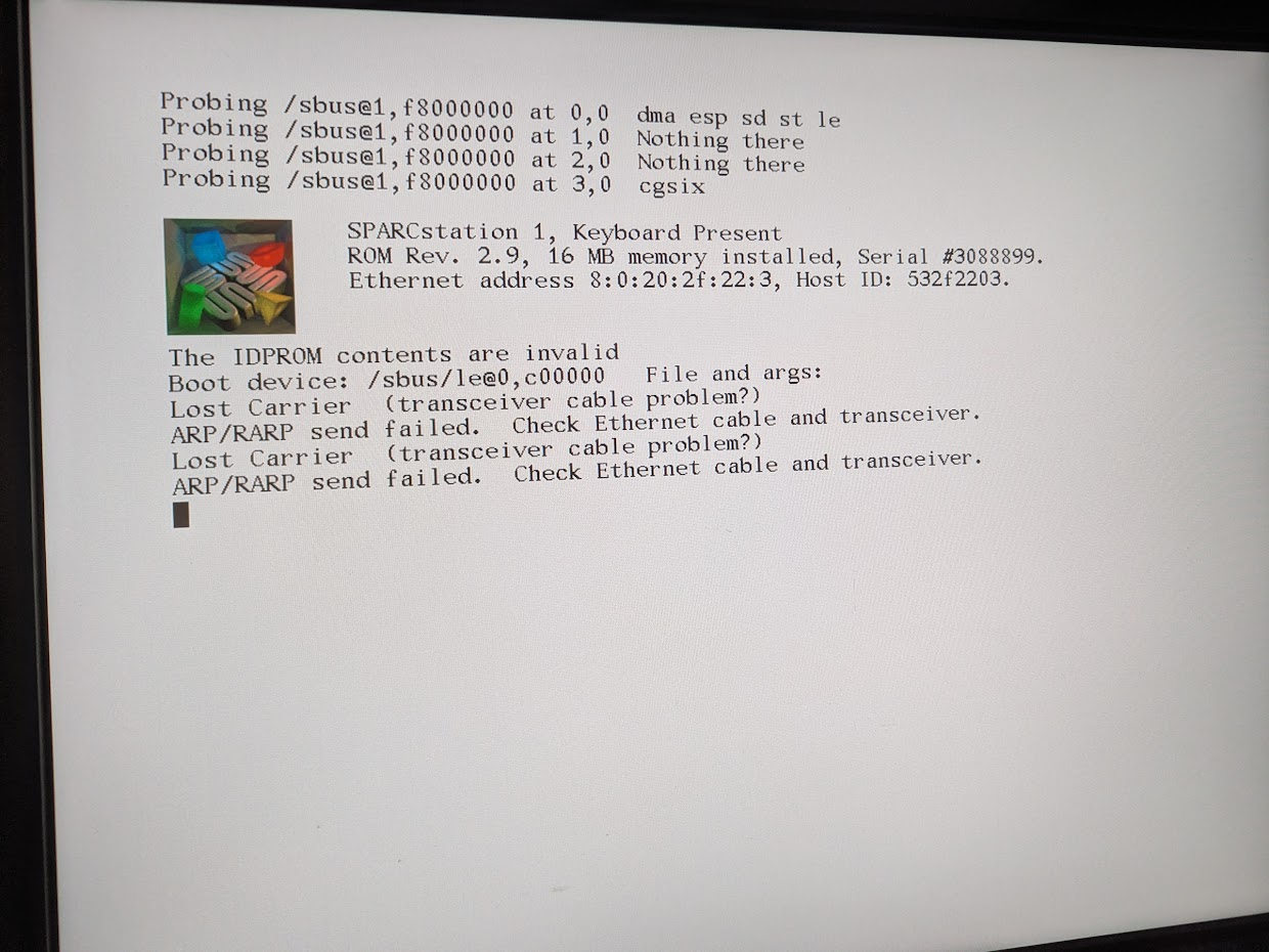 SPARCstation 1 ROM 2.9 boot screen with a postage-stamp sized prerendered logo. it's the rectangular SUN logo in an isometric view with a green cylinder, a blue cube, a yellow pyramid, and a red hemisphere tastefully arranged nearby.