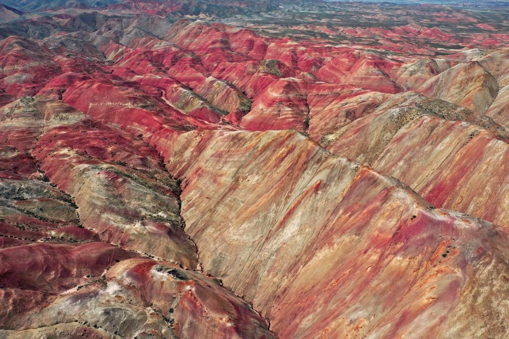 Snow melts to reveal the vibrant Rainbow Hills.
