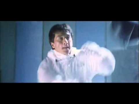 Jackie Chan training on the speed ball. Jackie Chan is wearing all white suit, training rain coat.