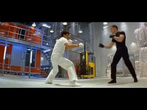 Jackie Chan is in his boxing fighting stance, wearing all white cloths and shoes. "You like white." Jackie Chan was given white gloves by the "antagonist" (Neutral-alist?) by Bradley James Allen. Bradley James Allen is in his boxing stance, wearing all black cloths and shoes. His gloves are black.
Sadly, Bradley passed away in 2021 at 48.