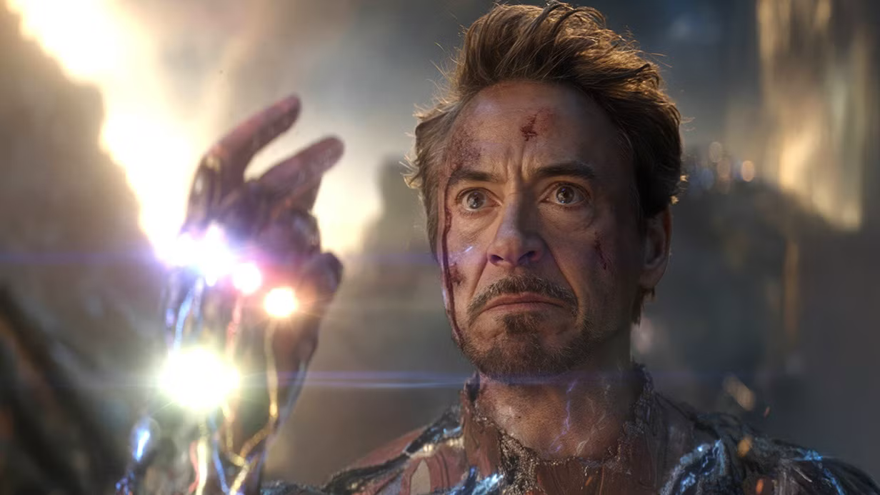 Tony Stark wearing the Infinity Gauntlet, looking determined but sad, about to snap and (spoiler warning for the avengers movies, I guess) defeat Thanos and subsequently die himself.