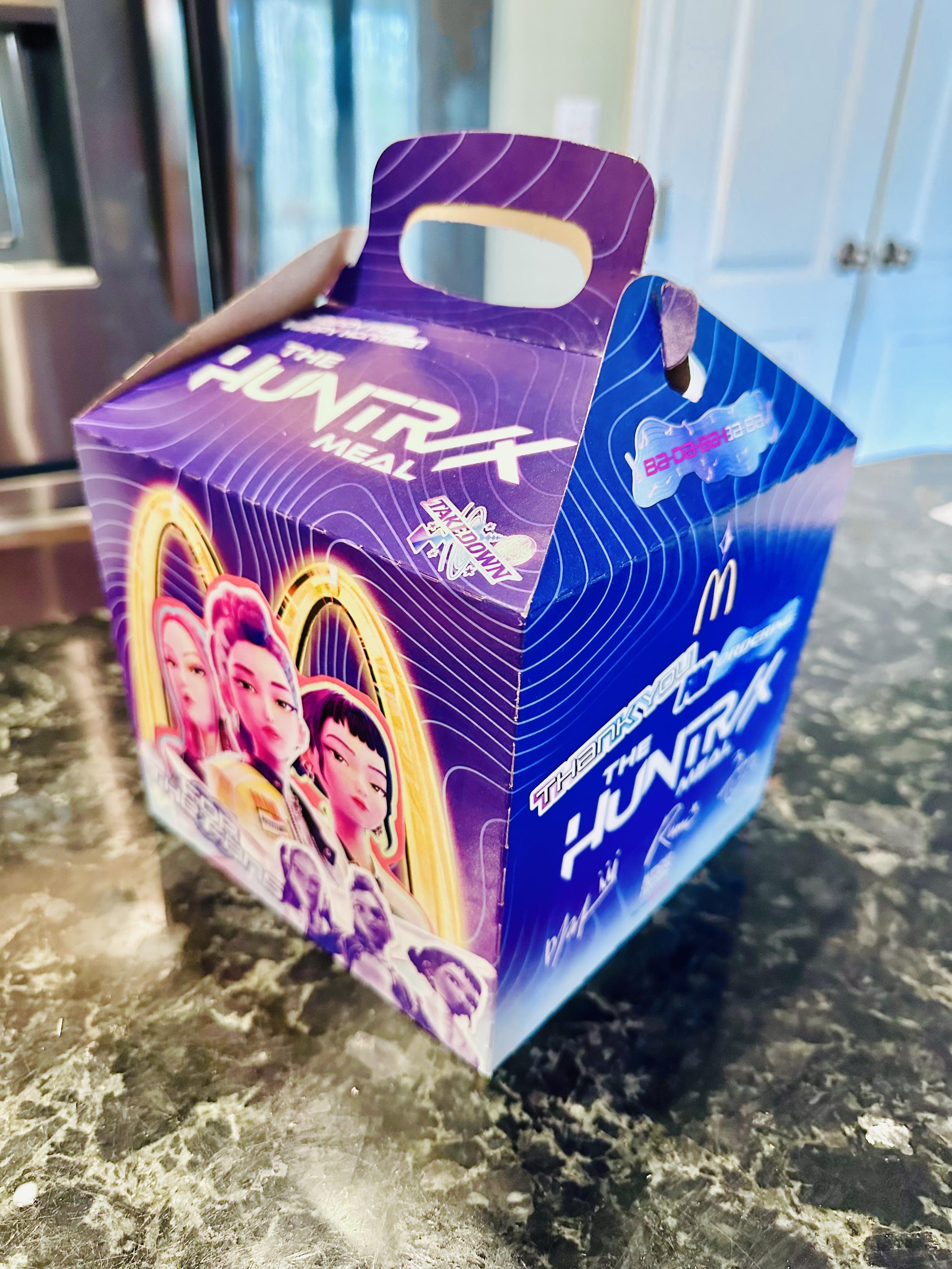 The picture of the new Demon hunters breakfast happy meal box sitting on my countertop.