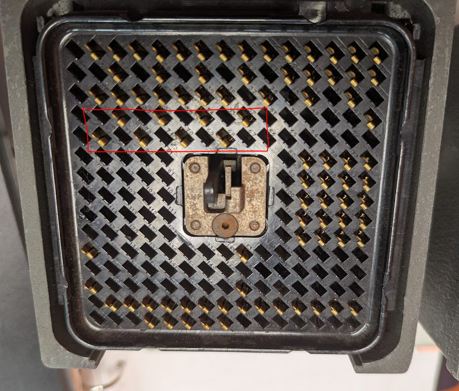 cluster of 8 pins with a red box around them just under the top section. they are empty boxes in the official IBM diagram.