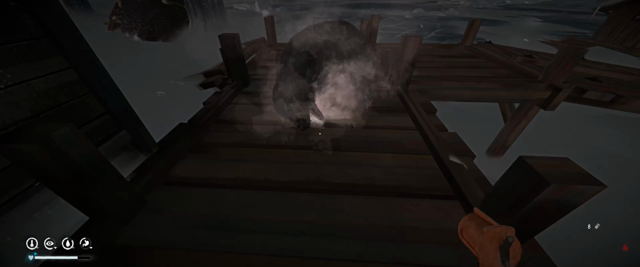 Video clip from “The Long Dark” showing the corpse of a bear lying on the boardwalk of a dock in a frozen bay with snow all around, with a flare from a flare gun still burning in its mouth.
The POV character walks around the bear, examining (honestly I was making sure the damn thing was dead) and then reloads the flare gun