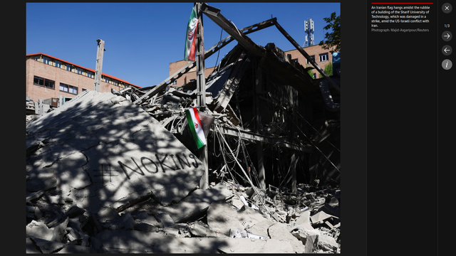 PHOTO: An Iranian flag hangs amidst the rubble of a building at the Sharif University of Technology, which was damaged in a strike, amid the US-Israeli conflict with Iran.

In the rubble, a piece of wall spray-painted with "#NOKING" (hashtag No King)

Photograph: Majid-Asgaripour/Reuters