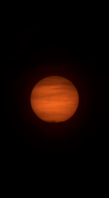 A timelapse video through a telescope of the setting sun. As clouds overtake the disk of the sun, the automated tracking has difficulty keeping the sun in the center. Eventually the sun passes behind a transmission tower.
