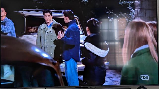 Friends scene showing a camera man on the left hand side.