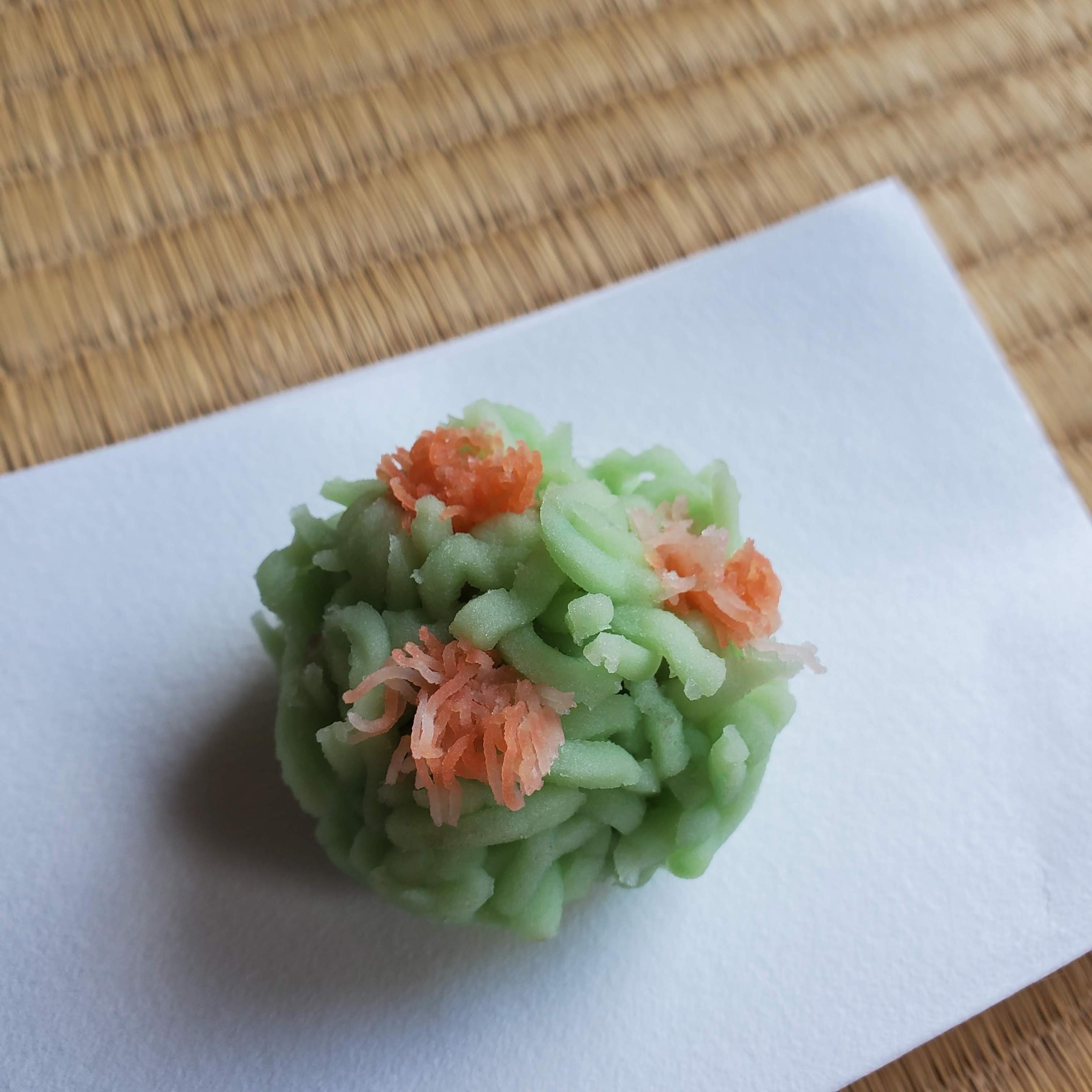 'Tsutsuji kinton' is a colourful looking sweet that mimics a miniature azalea bush. Kinton are made from a type of yam (the soft dough coloured and shredded, and carefully placed around a sweet bean jam filling).