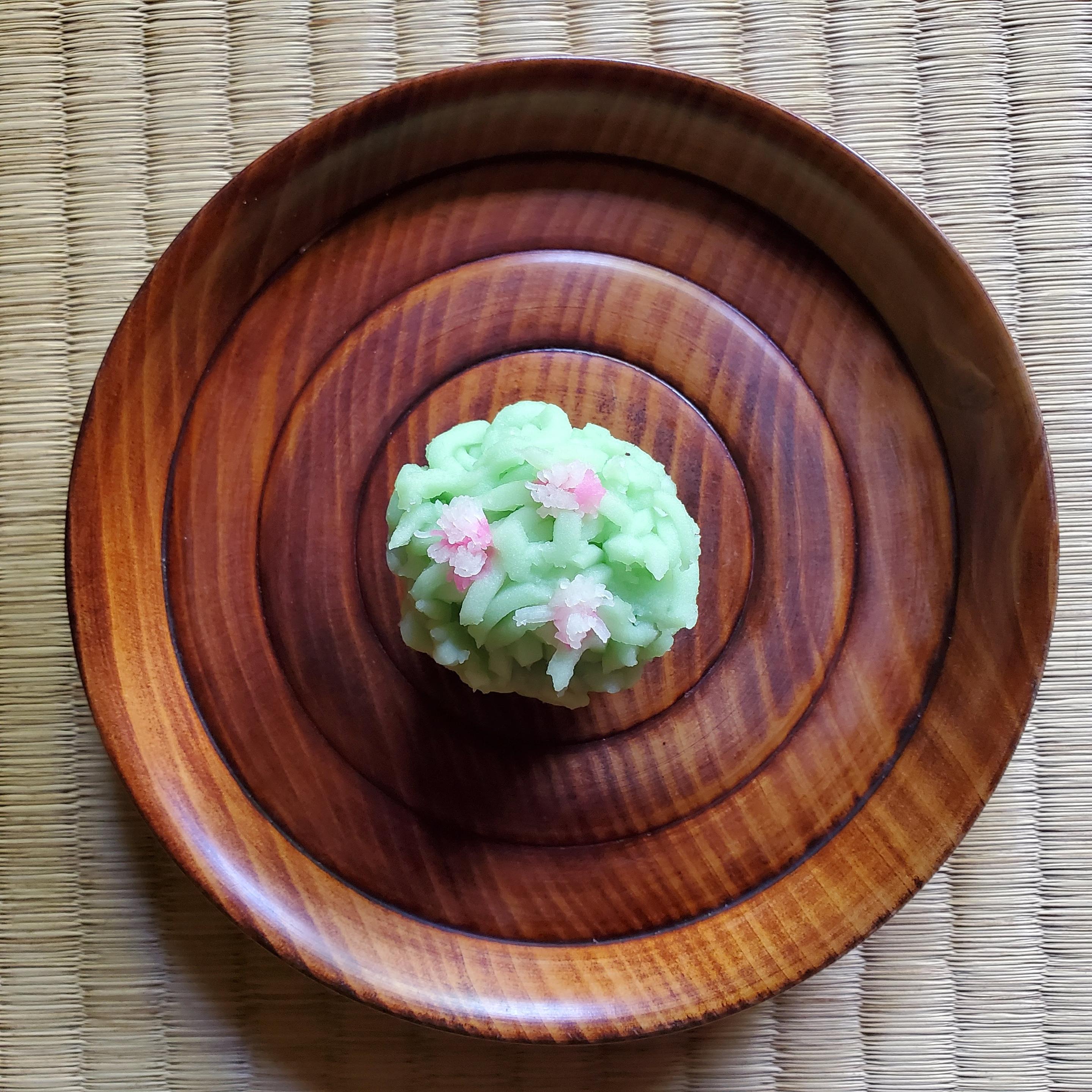 'Tsutsuji kinton' is a colourful looking sweet that mimics a miniature azalea bush. Kinton are made from a type of yam (the soft dough coloured and shredded, and carefully placed around a sweet bean jam filling).