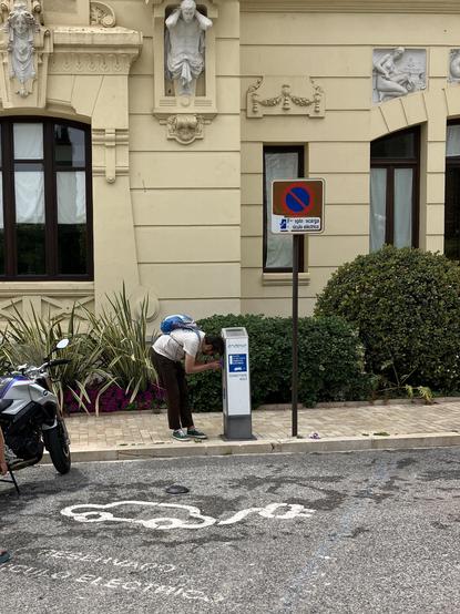 Person looking at an EV charging station