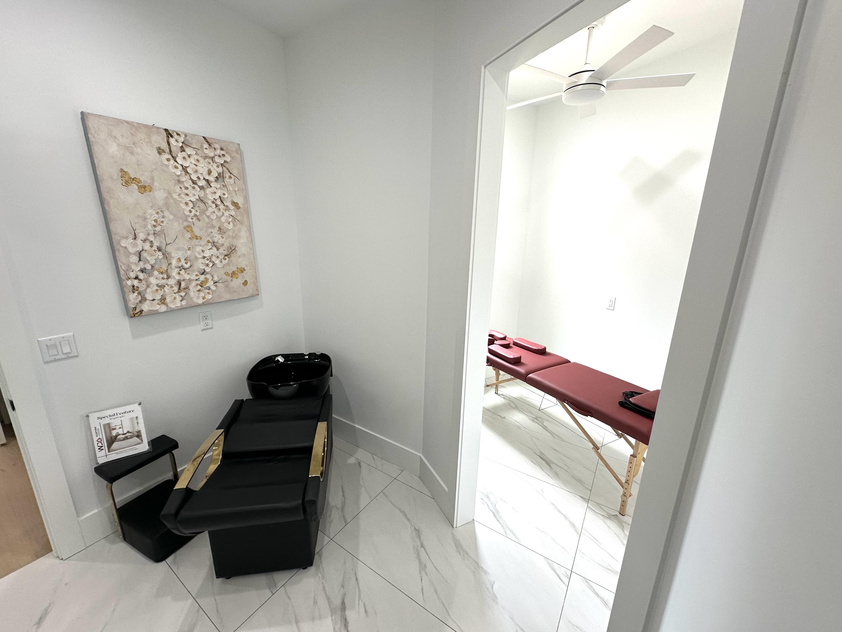 Personal salon with a hair washing station and a separate room for a masseuse table.
