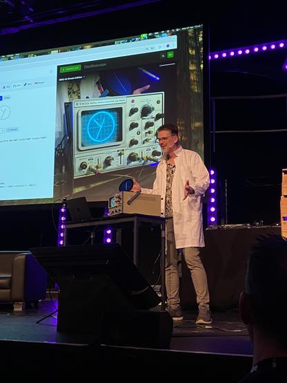 Niels Leenheer showing a demo of a CSS and SVG clock running on an oscilloscope 