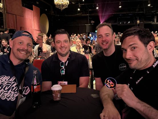 A table with Nils Binder, Brecht de Ruyte, Bramus van Damme, and Matthias Ott - all smiling of course