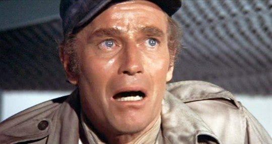 Soylent Green (1973): Detective Robert Thorn (Charles Heston) reveals the twist at the end of the film: Soylent Green, the food product that keeps the overpopulated populace of the future alive, is made from the corpses of the dead.