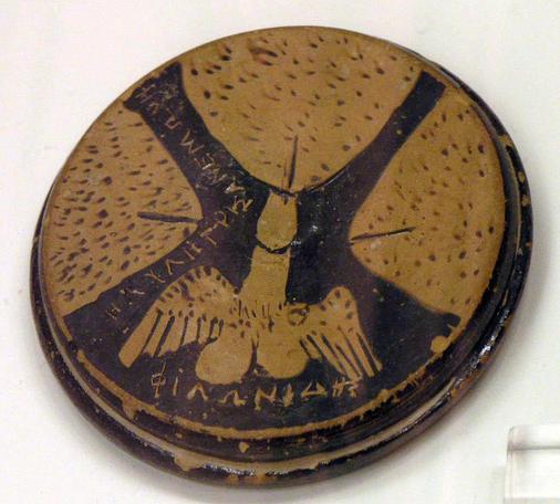 Attic red-figure painting on a lid depicting three vulvas and a winged phallus, dated 460–425 BCE. Today it can be admired in the Archaeological National Museum in Athens.